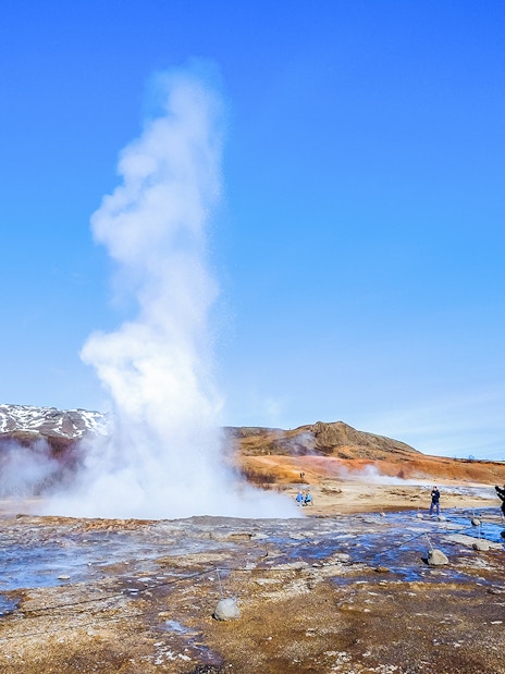 Geyser erupting in Haukadalur Valley, part of Iceland's Golden Circle Tour.