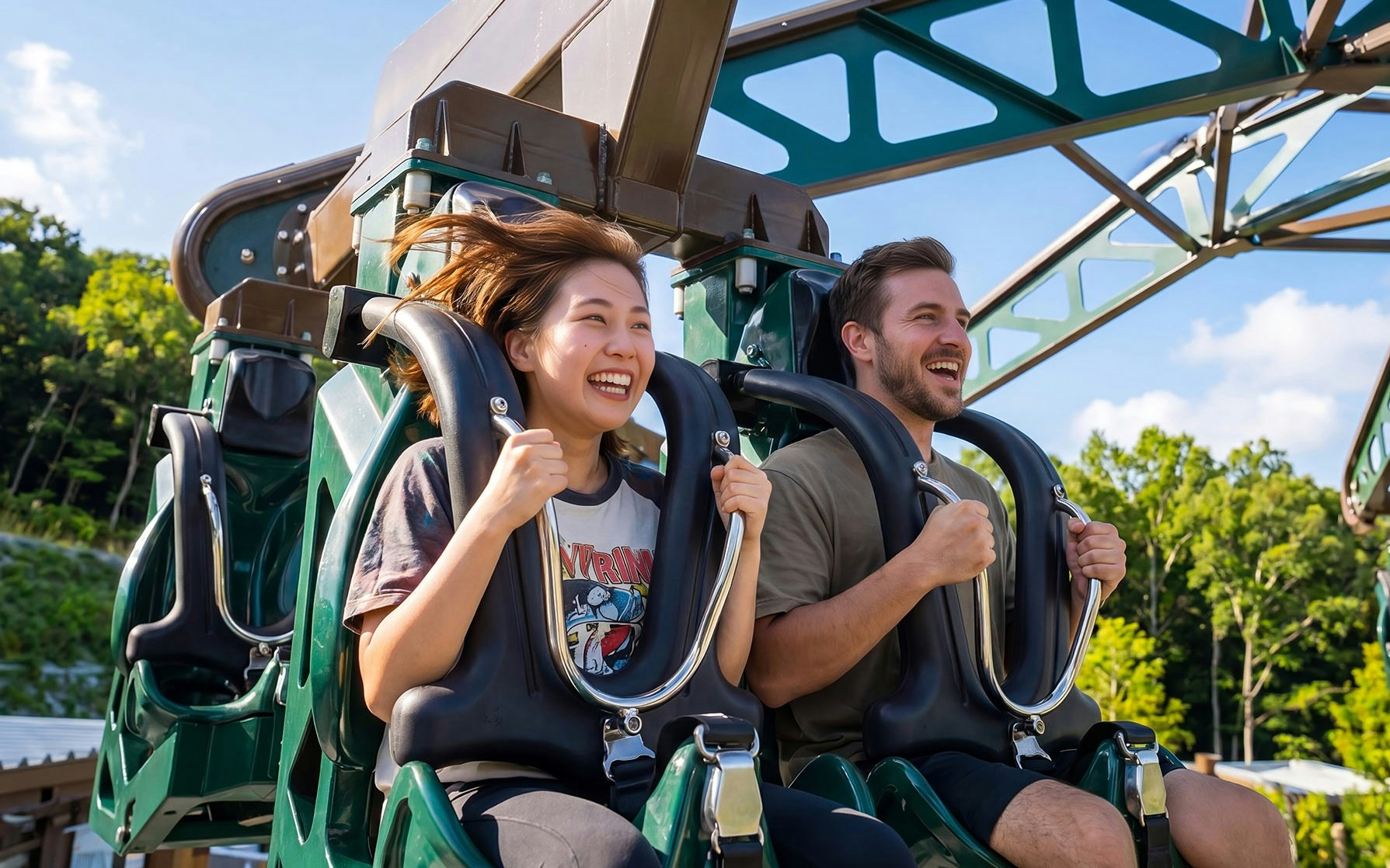 Riders enjoying the Yambaru Tornado roller coaster at Jungalia, Okinawa.