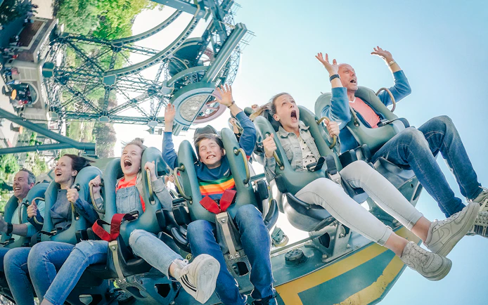 Guests enjoying a roller coaster ride at Efteling Theme Park.