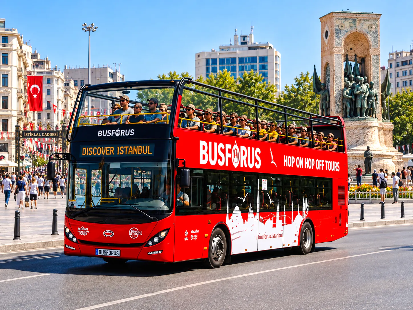 Open-top tour bus in Istanbul near Taksim Square with Republic Monument in the background.