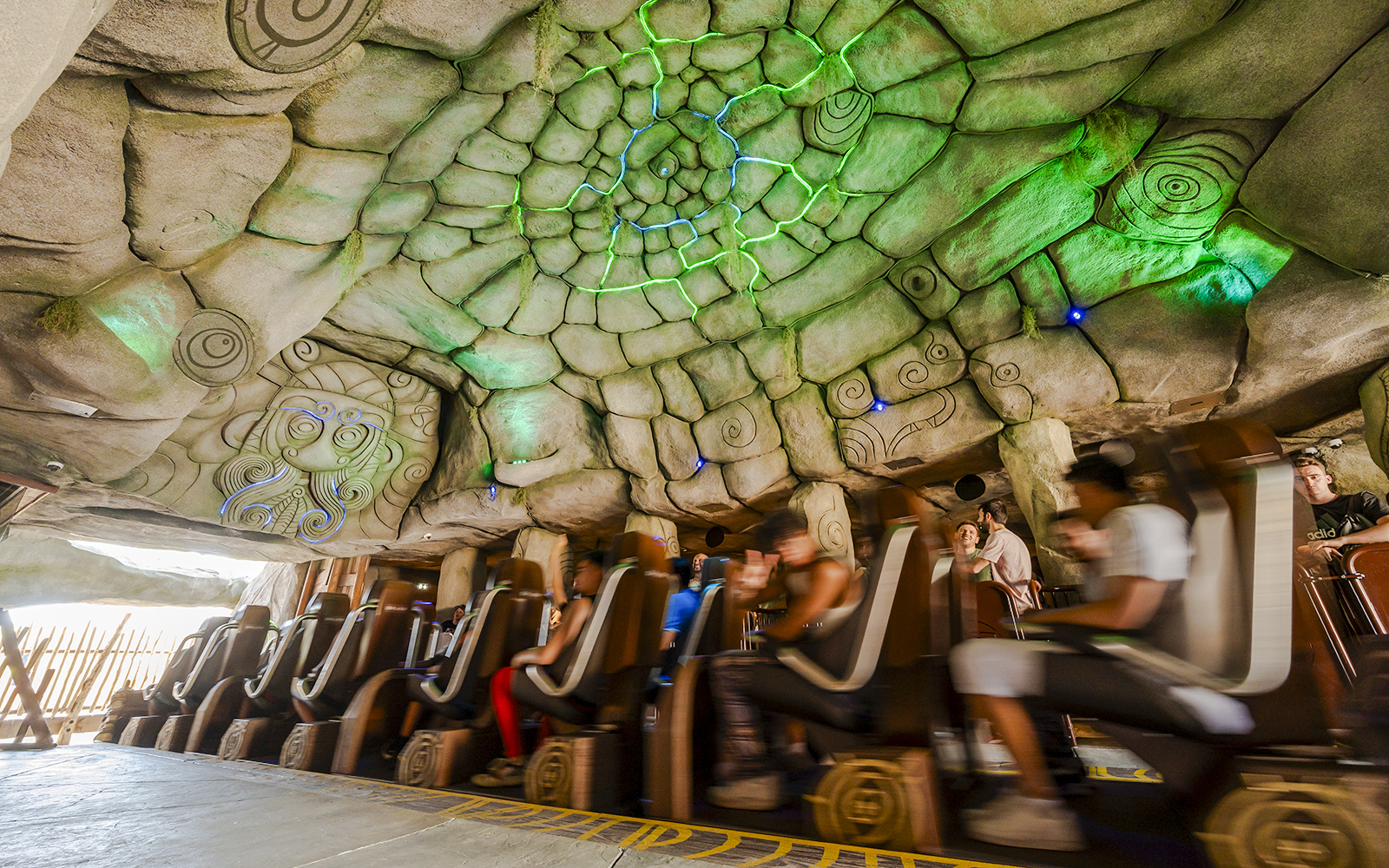 Roller coaster ride inside themed cave at Parc Asterix, France.