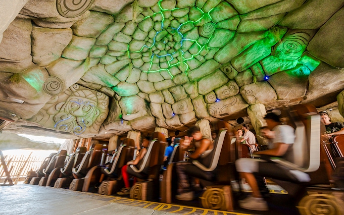 Roller coaster ride inside themed cave at Parc Asterix, France.