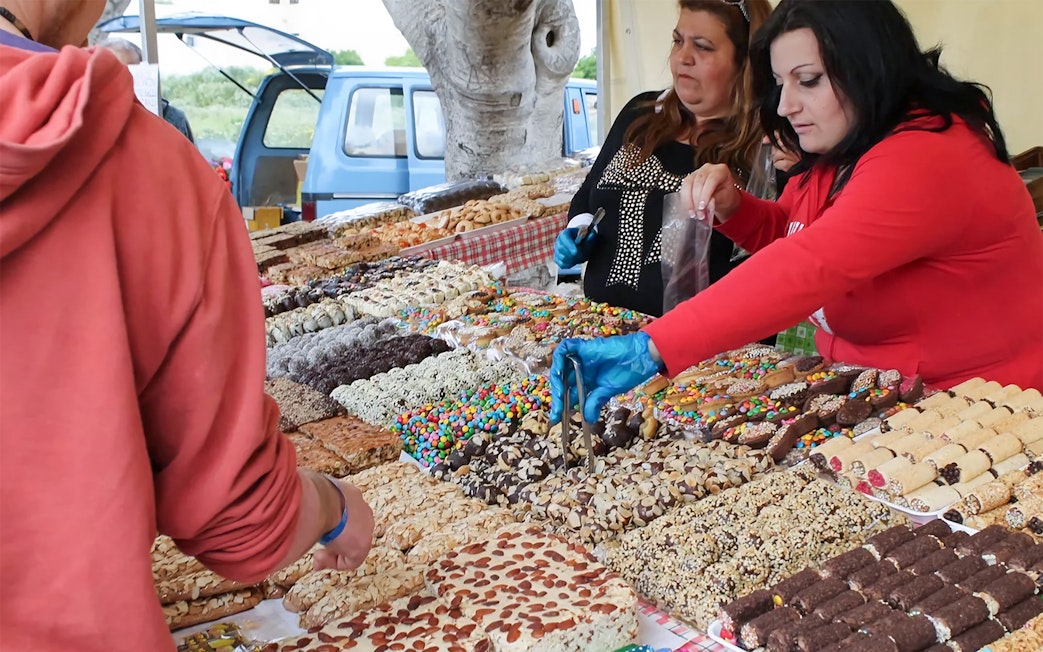 Market stall with local sweets and pastries during Prehistoric Temples & Highlights Of The South tour.
