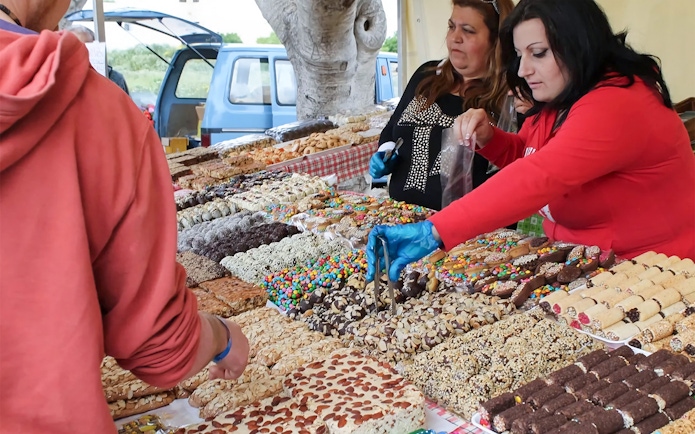 Market stall with local sweets and pastries during Prehistoric Temples & Highlights Of The South tour.