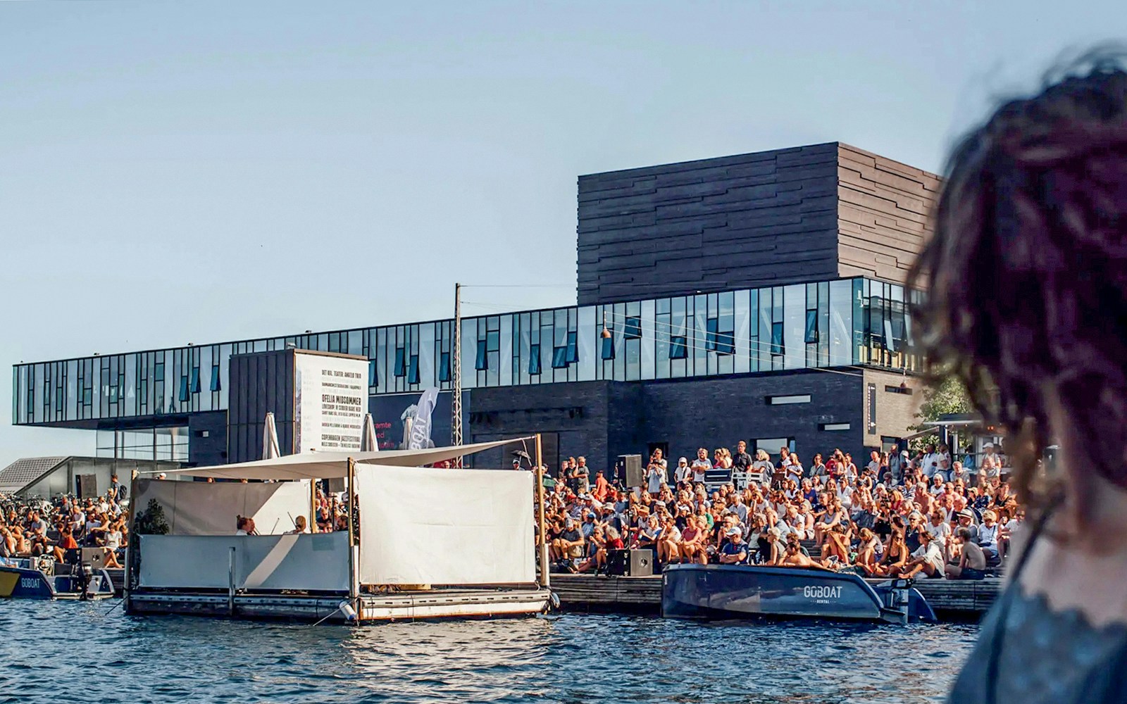 Copenhagen's Playhouse with waterfront view and modern architecture.