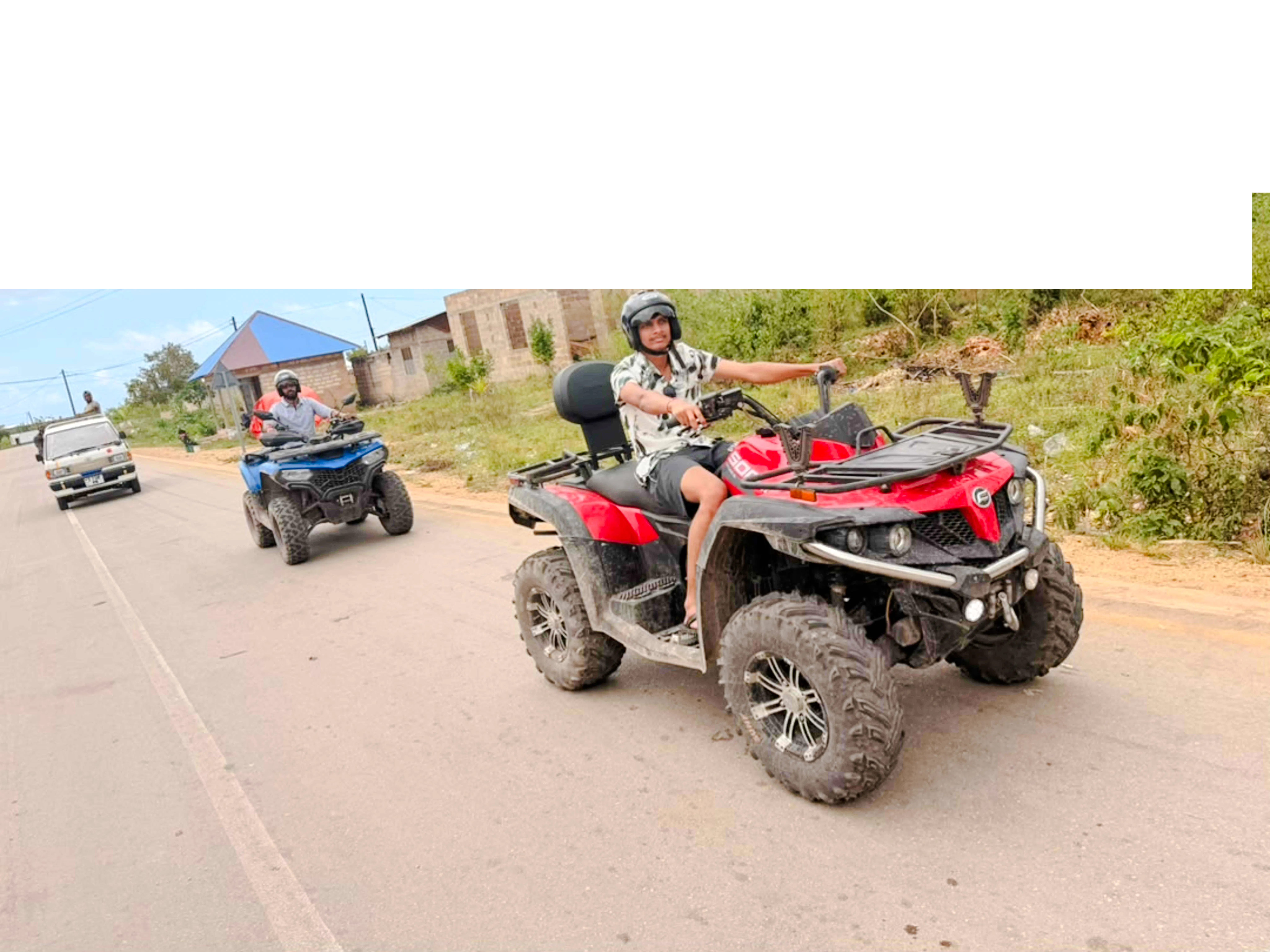 Quad biking adventure on a rural road in Zanzibar.