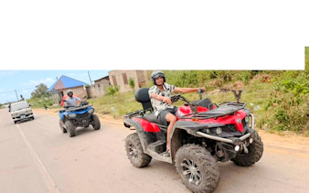 Quad biking adventure on a rural road in Zanzibar.