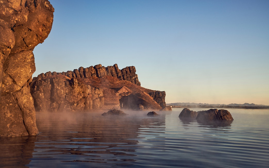 Sky Lagoon geothermal pool with rocky landscape at Saman Pass.