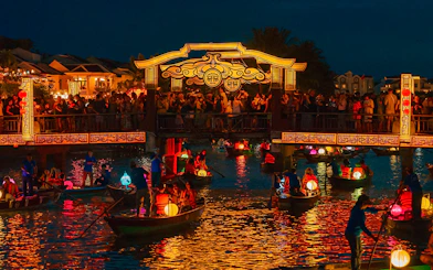Hoi An Night Market with lantern-lit boats on the Thu Bon River in Hoi An Ancient Town.