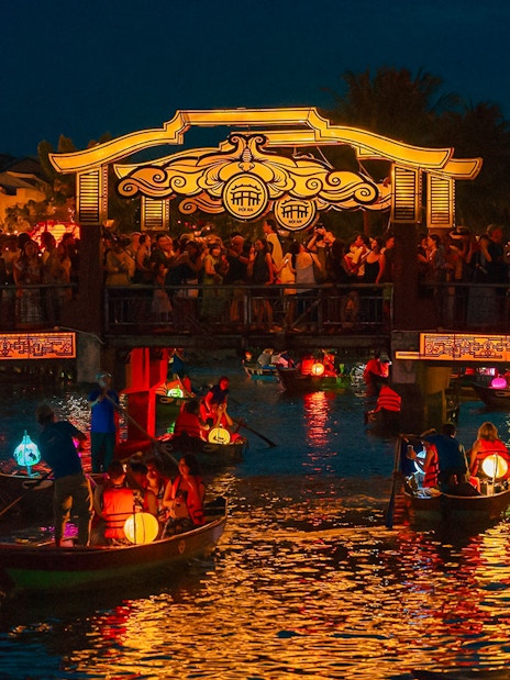 Hoi An Night Market with lantern-lit boats on the Thu Bon River in Hoi An Ancient Town.