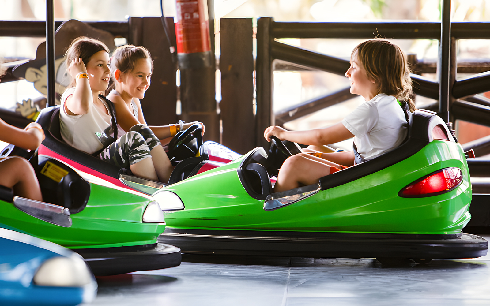 Children enjoying Rugrats Bumper Cars at Parque de Atracciones de Madrid.