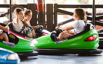 Children enjoying Rugrats Bumper Cars at Parque de Atracciones de Madrid.