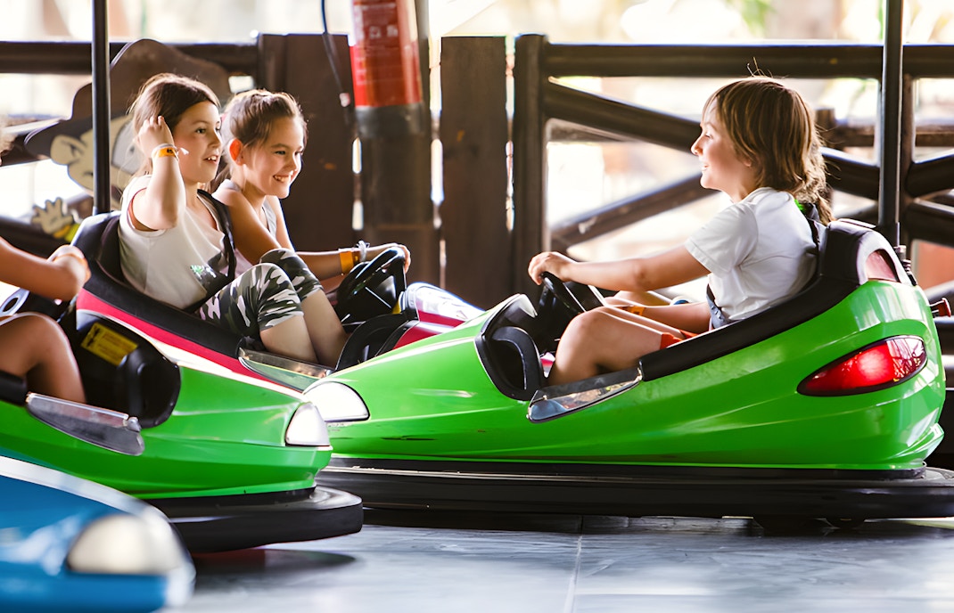 Rugrats Bumper Cars ride at Parque de Atracciones de Madrid, featuring colorful cartoon-themed vehicles.