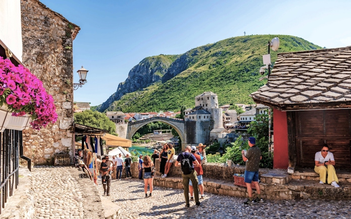 Old Town of Mostar with Stari Most bridge and tourists, Bosnia-Herzegovina.