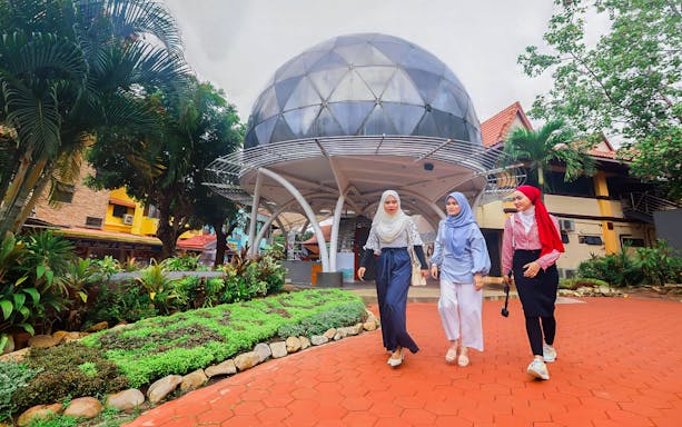 Women walking near Langkawi Cable Car entrance, Malaysia.