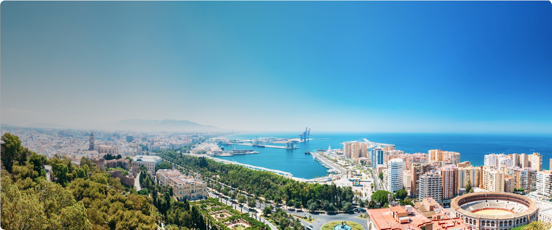 Aerial view of Malaga cityscape with the port and bullring, Spain.