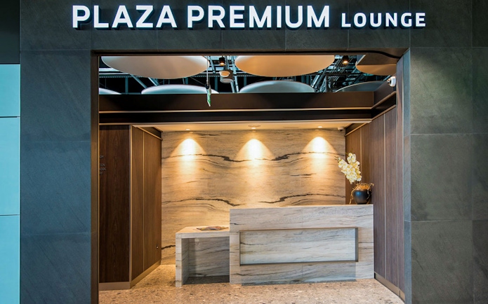 Heathrow Plaza Premium Lounge entrance with modern reception desk.