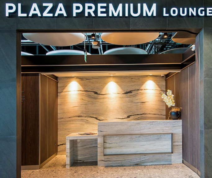 Heathrow Plaza Premium Lounge entrance with modern reception desk.