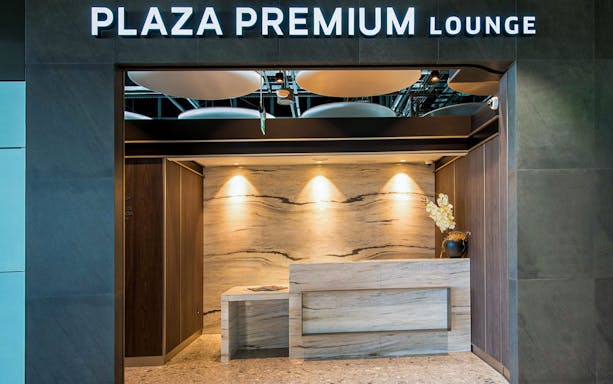 Heathrow Plaza Premium Lounge entrance with modern reception desk.
