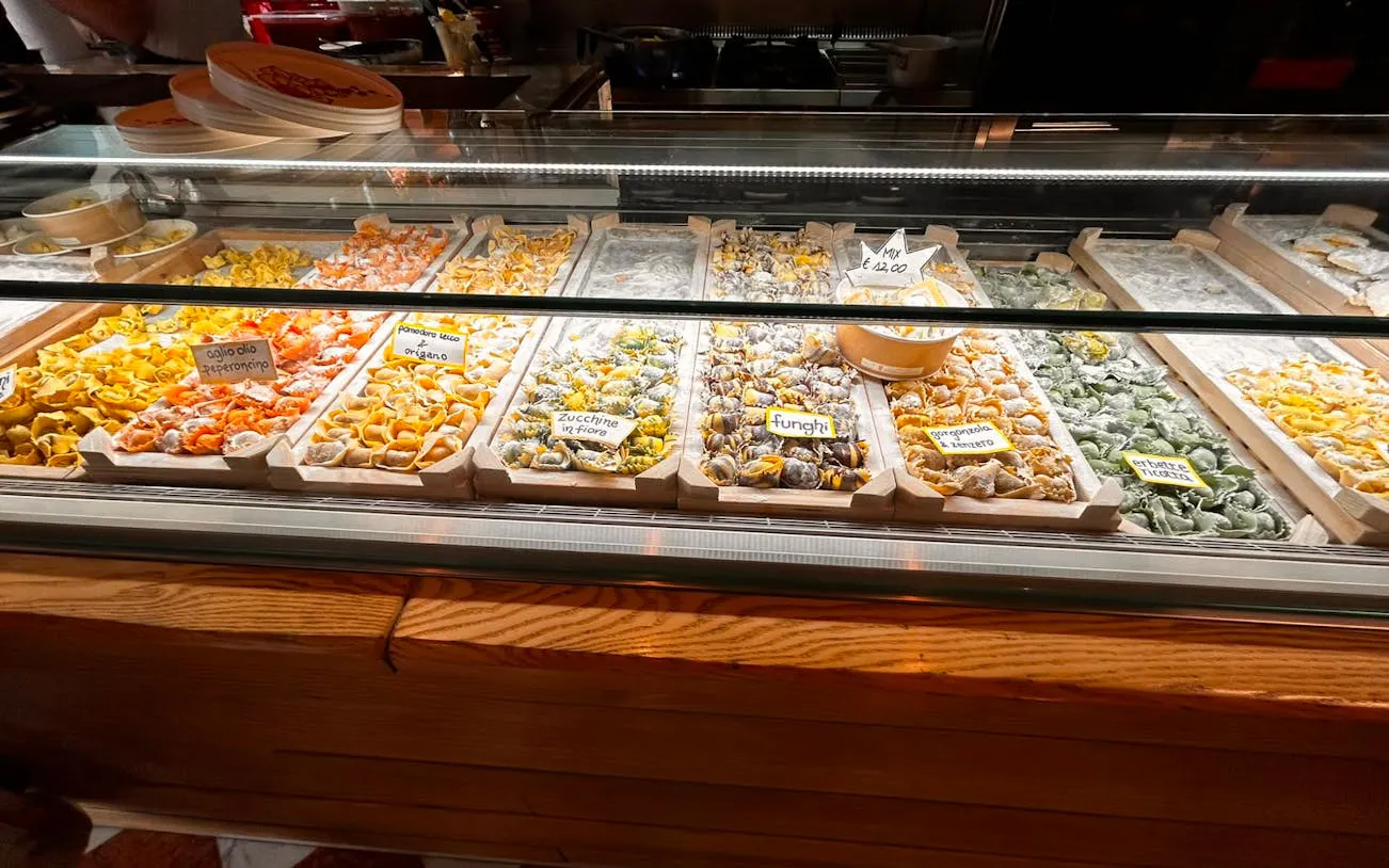 Assorted fresh pasta varieties displayed in a Verona shop for the Romeo & Juliet Food Tour.