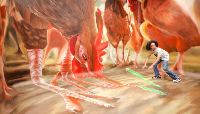 Guest interacting with giant chicken art at TiLT Interactive Museum, American Dream.