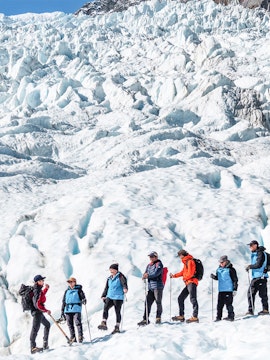 Group hiking on Fox Glacier with guide, New Zealand.