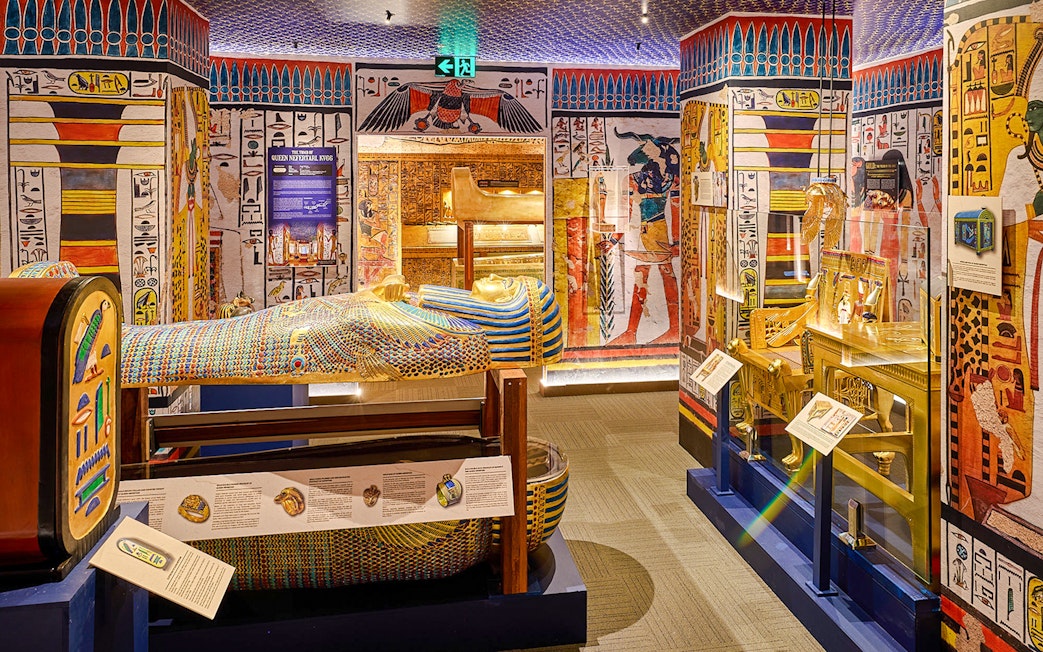 Sarcophagus and Egyptian artifacts displayed at the Tomb of the Pharaoh exhibit.