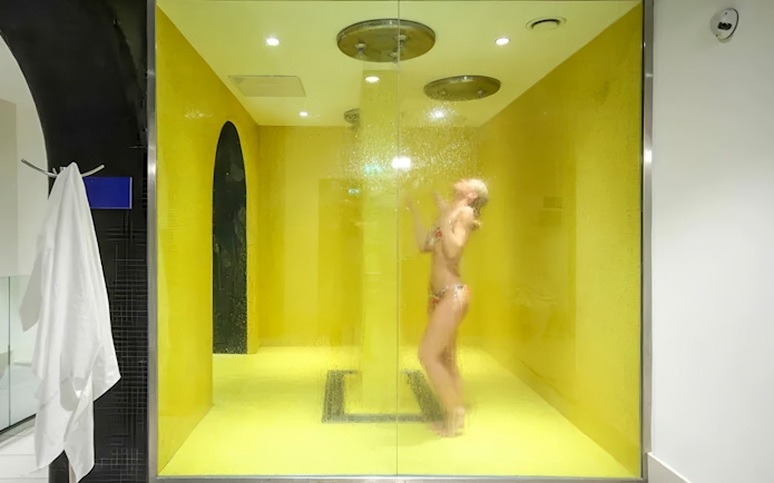 Person enjoying a steam shower at Dandar Spa.