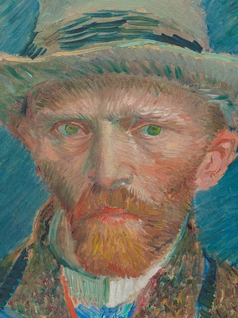Self-portrait by Vincent van Gogh, 1887, featuring the artist in a hat against a blue background.
