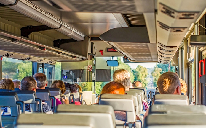 Tourists on a bus heading to Krka Waterfalls from Split, Croatia.