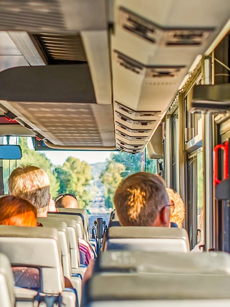 Tourists on a bus heading to Krka Waterfalls from Split, Croatia.