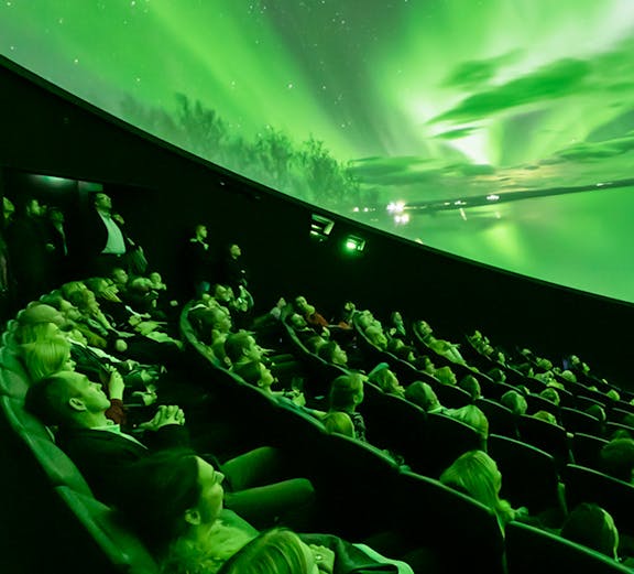 Visitors watching Northern Lights display at Perlan Museum, Reykjavik.