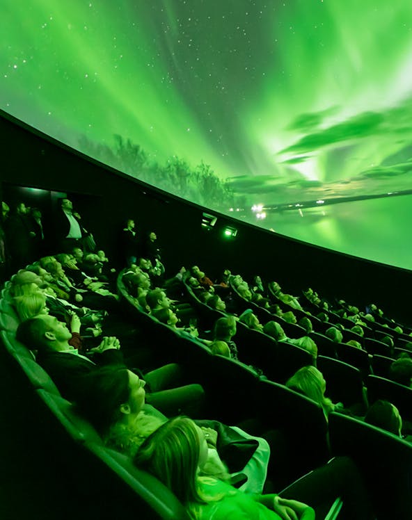 Visitors watching Northern Lights display at Perlan Museum, Reykjavik.