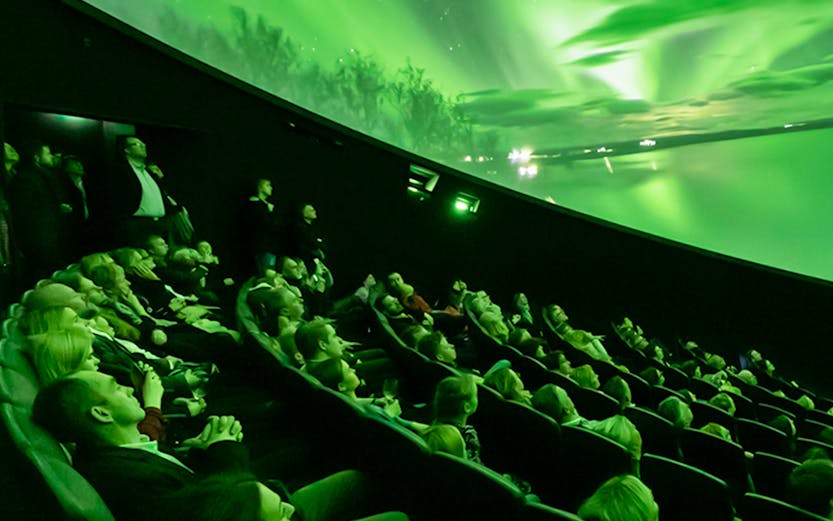 Visitors watching Northern Lights display at Perlan Museum, Reykjavik.