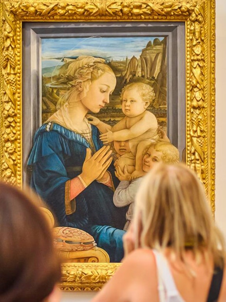 Visitors viewing Lippi's Madonna and Child at Accademia Gallery, Florence.