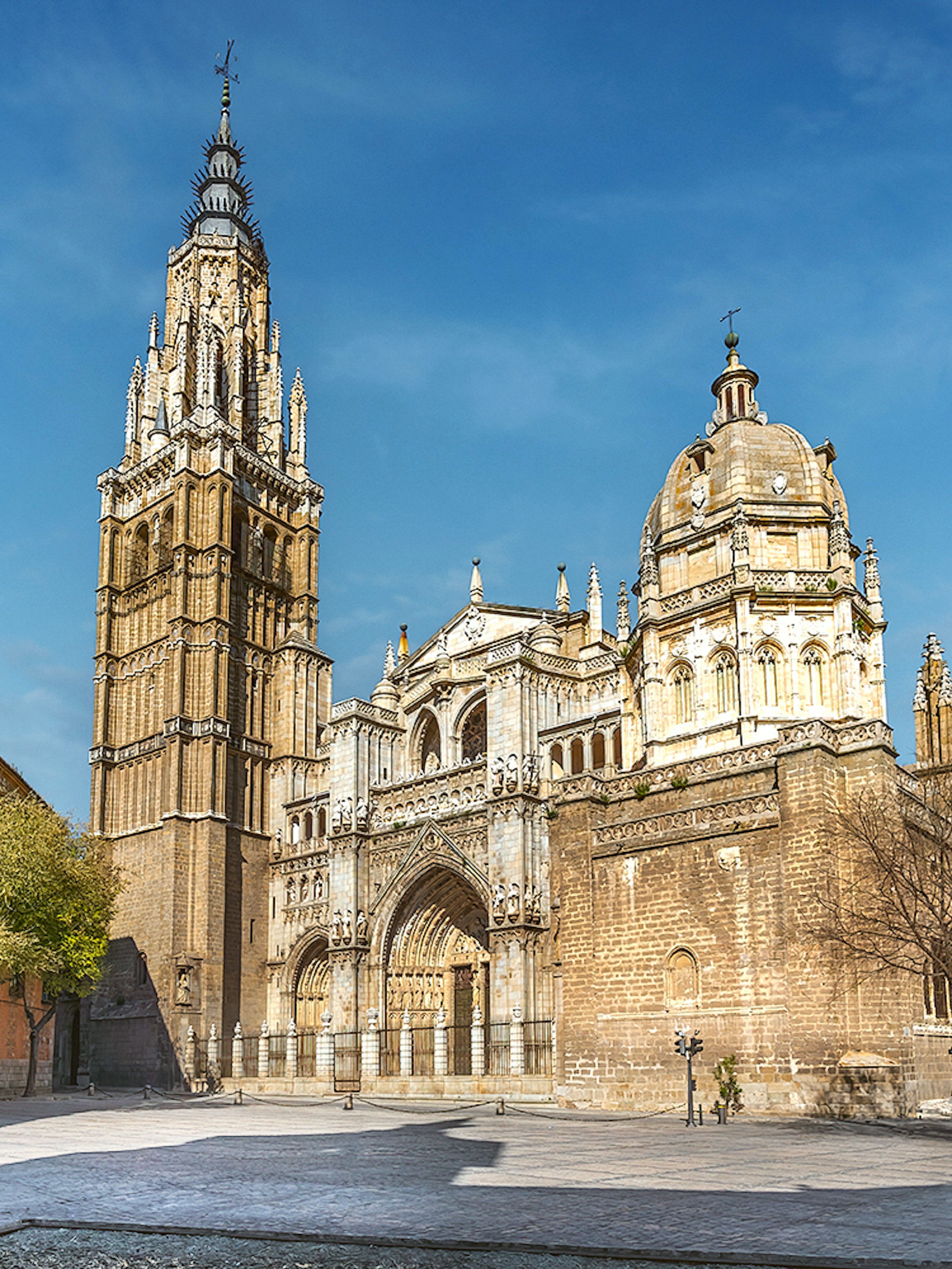 Cathedral of Toledo exterior with bell tower and ornate facade on a guided tour.