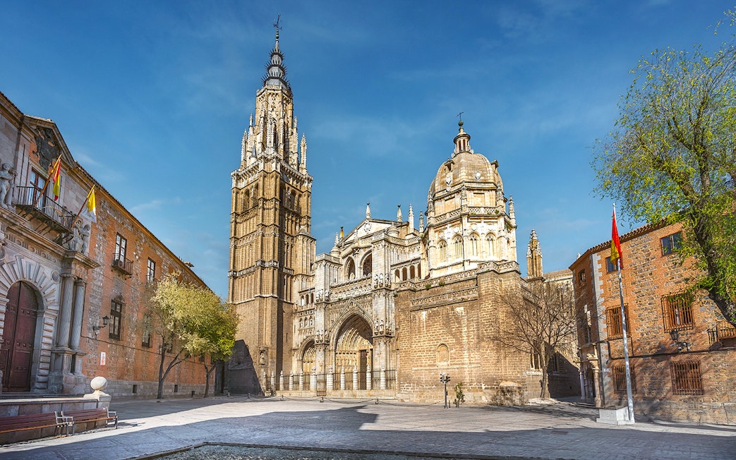 Cathedral of Toledo exterior with bell tower and ornate facade on a guided tour.