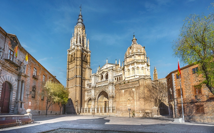 Cathedral of Toledo exterior with bell tower and ornate facade on a guided tour.