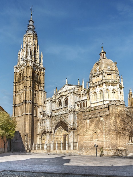 Cathedral of Toledo exterior with bell tower and ornate facade on a guided tour.