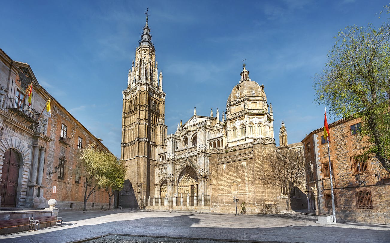 Cathedral of Toledo exterior with bell tower and ornate facade on a guided tour.