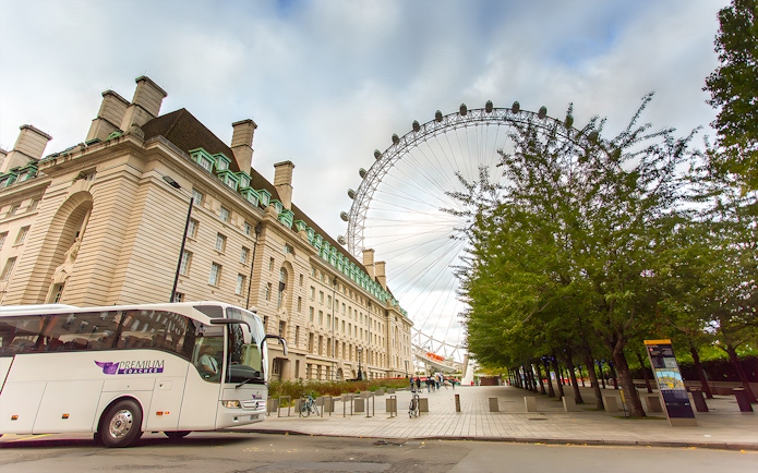 London Eye and County Hall near tour bus on Magic of London Tour.