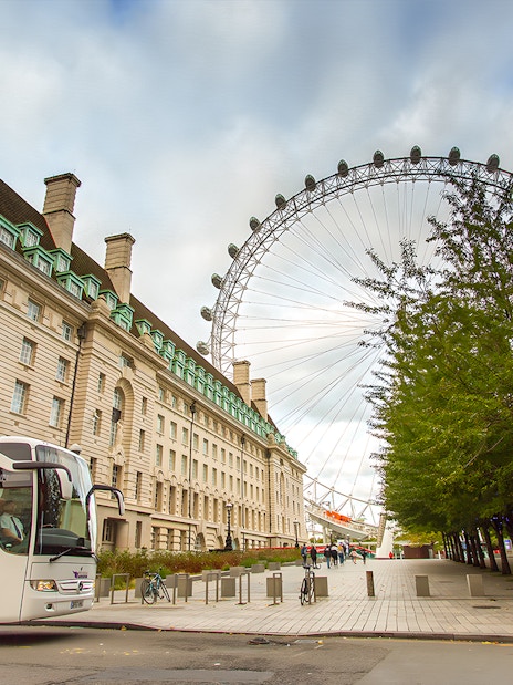 London Eye and County Hall near tour bus on Magic of London Tour.