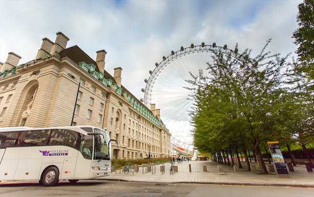 London Eye and County Hall near tour bus on Magic of London Tour.