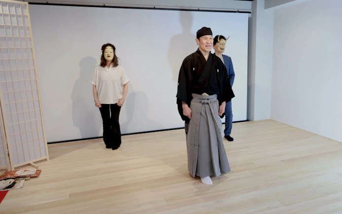 Noh performers in traditional attire during a workshop in Kyoto.
