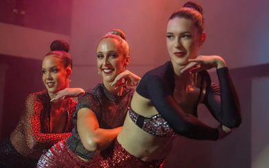 Cabaret performers dancing on a cruise with a 3-course dinner.