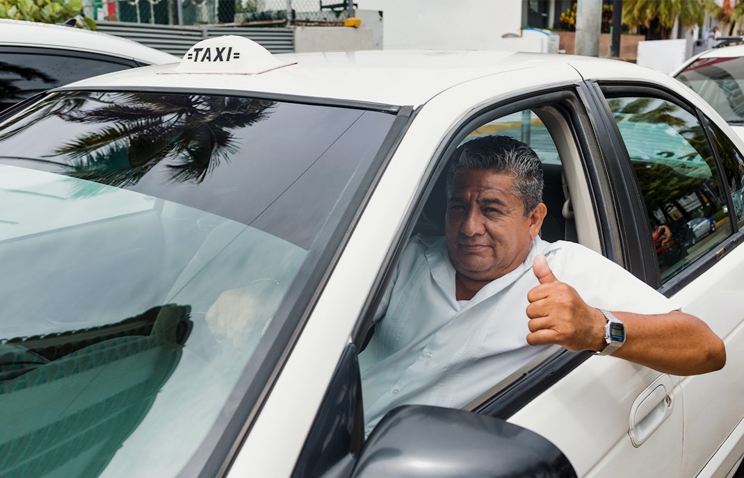 Taxi driver inside taxi, mexico