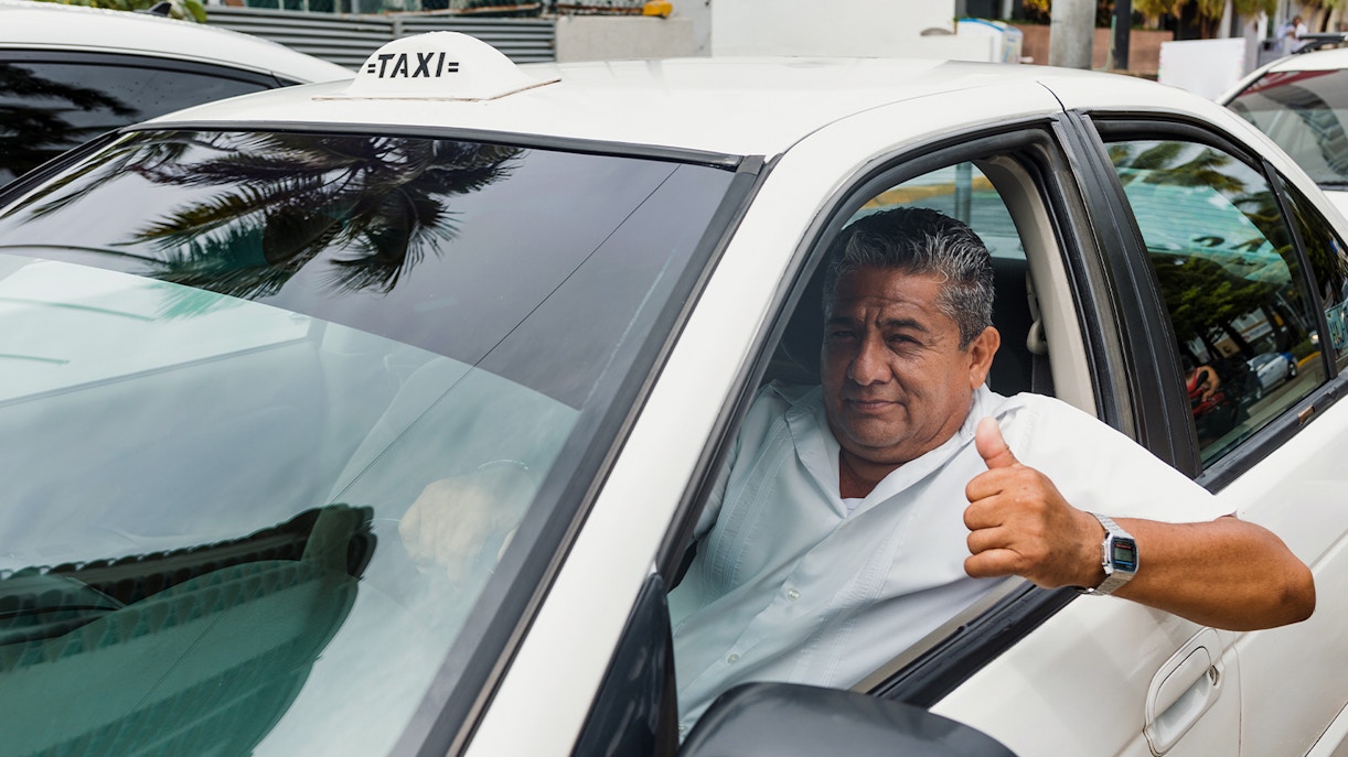 Taxi driver inside taxi, Mexico