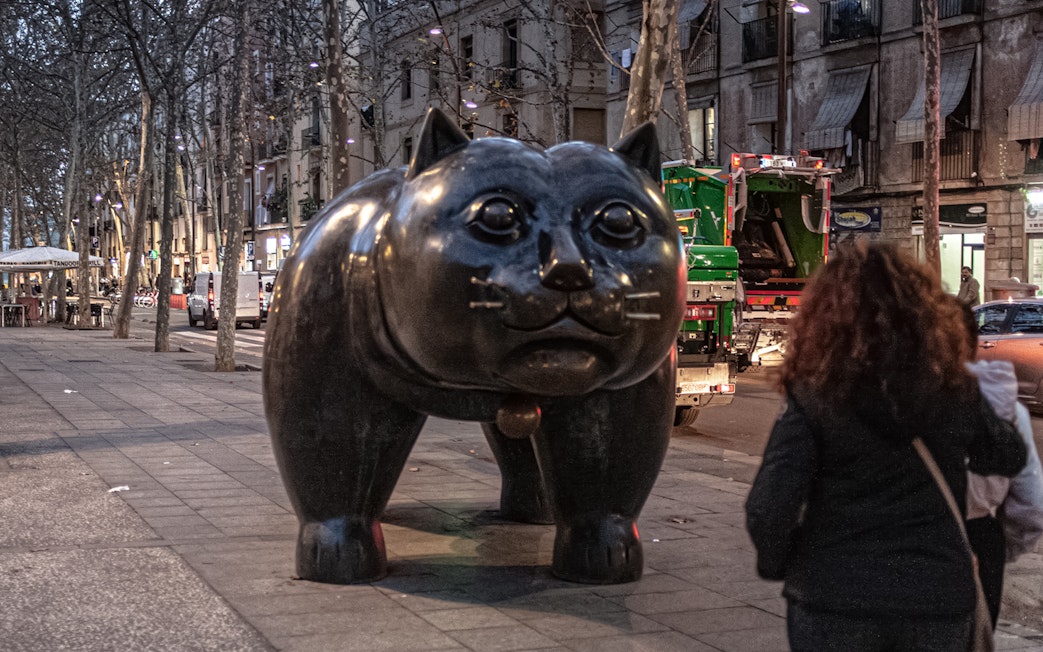 Raval's Botero Cat sculpture on a street in Barcelona.