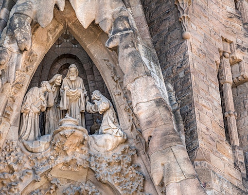 Sagrada Familia Passion Facade sculptures in Barcelona, Spain, showcasing intricate biblical scenes.