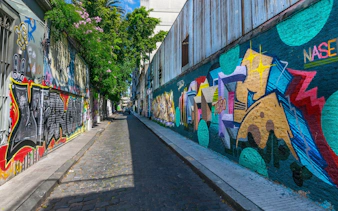 Graffiti-covered street in Buenos Aires during a city tour.